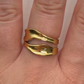 Golden Wave Ring worn on finger